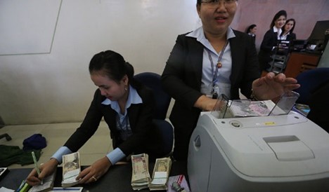 ธนาคารกลางกัมพูชาผลักดันการใช้สกุลเงินเรียลผ่านการจ่ายเงินเดือน